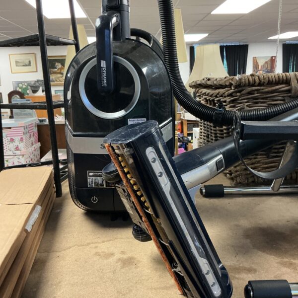 Shark upright hoover for home cleaning and collecting.