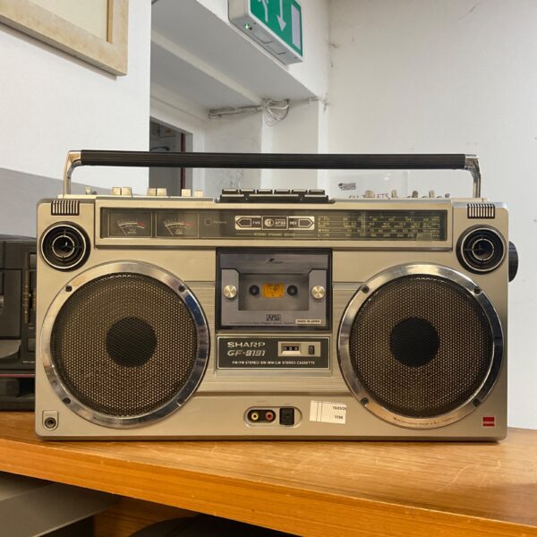 Vintage Sharp GF-9192 boombox with cassette player and radio.