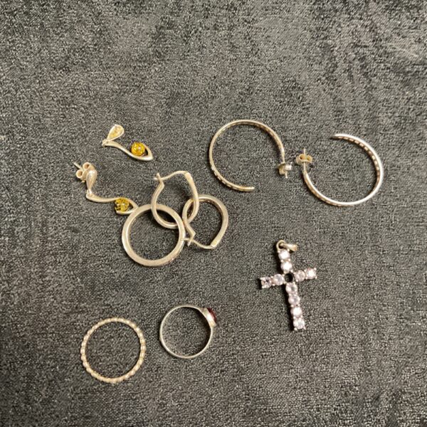 Close-up of a mixed lot of vintage silver rings and bracelets.