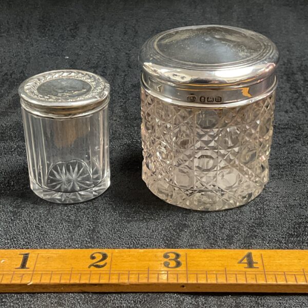 Vintage silver lidded pin jar with floral embossed lid.
