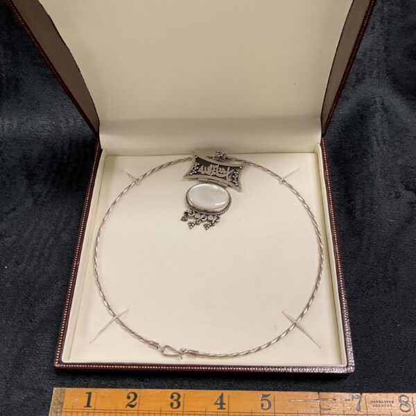 Vintage silver choker necklace with moonstone pendant, Middle Eastern style.