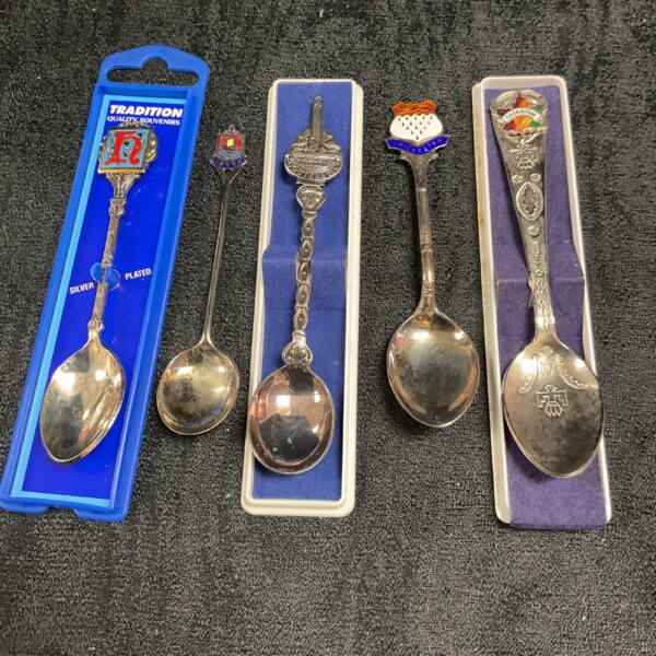 Lot of five vintage silver plate collectors spoons.
