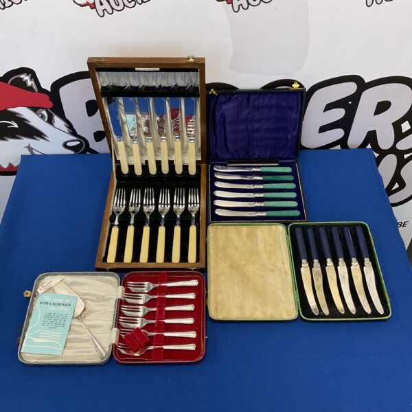 Cased silver plate cutlery sets with mango knives, vintage dining.