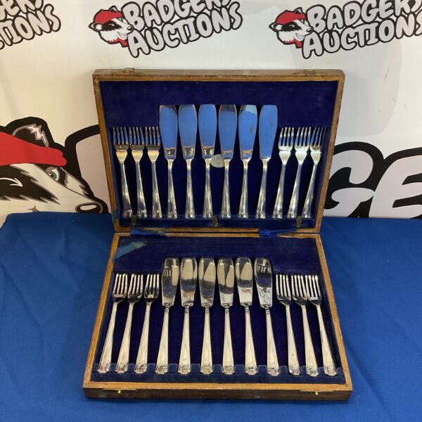 Vintage silver plate fish knife and fork set in velvet case.