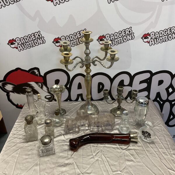 Vintage silver plate and glass collection on display.