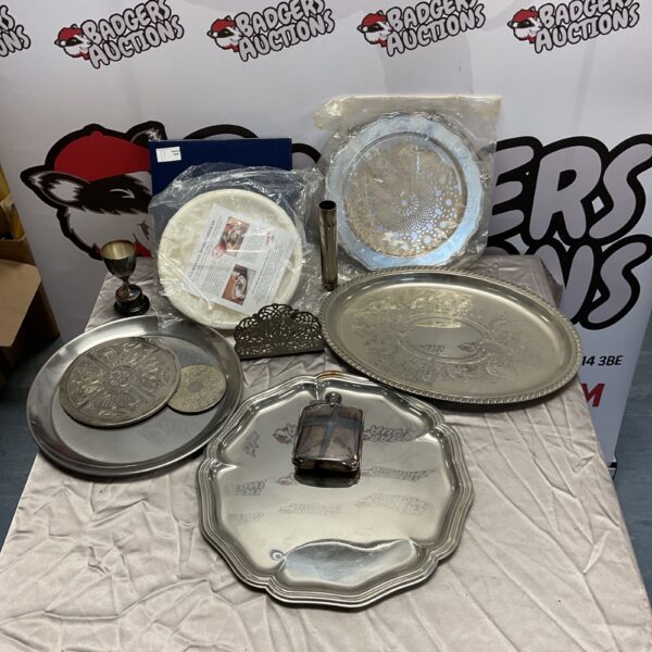 Vintage silver plate lot featuring serving trays and a hip flask.