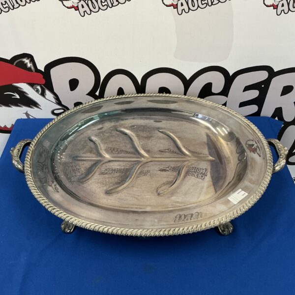 Antique silver plate meat warmer tray with ornate detailing.