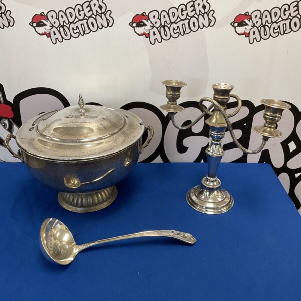 Vintage silver plate punch bowl set with ladle and candelabras.