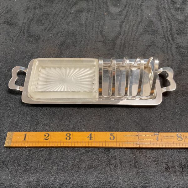 Vintage silver plated toast rack with glass butter dish.
