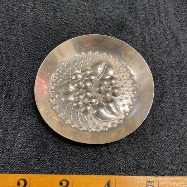 Antique 830 silver pin dish with floral repousse design.