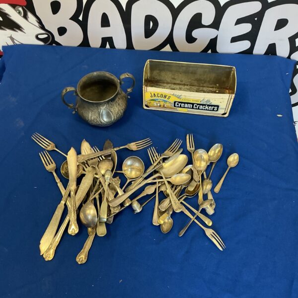 Mixed lot of vintage silverplate cutlery including spoons and forks.