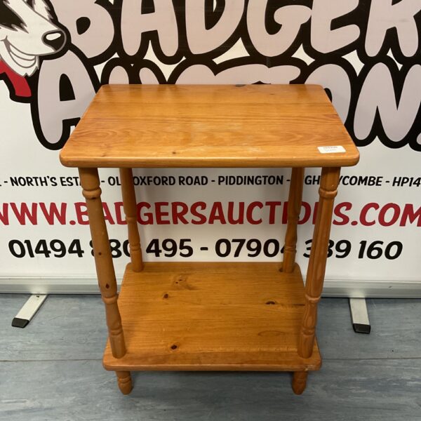 Small pine lamp table with turned legs and a single shelf.
