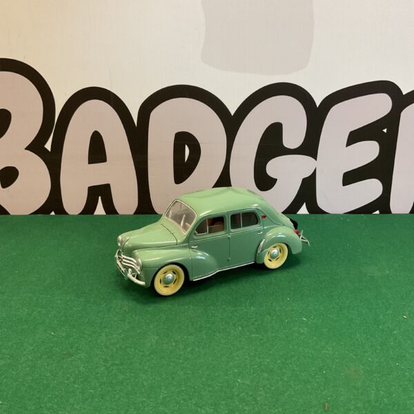 Green Solido Renault 4CV vintage model car on display.