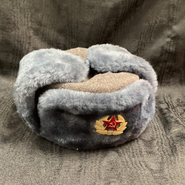 Vintage Soviet Ushanka hat with hammer and sickle badge.