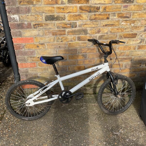 Side view of a used Spike Ollie BMX bike.