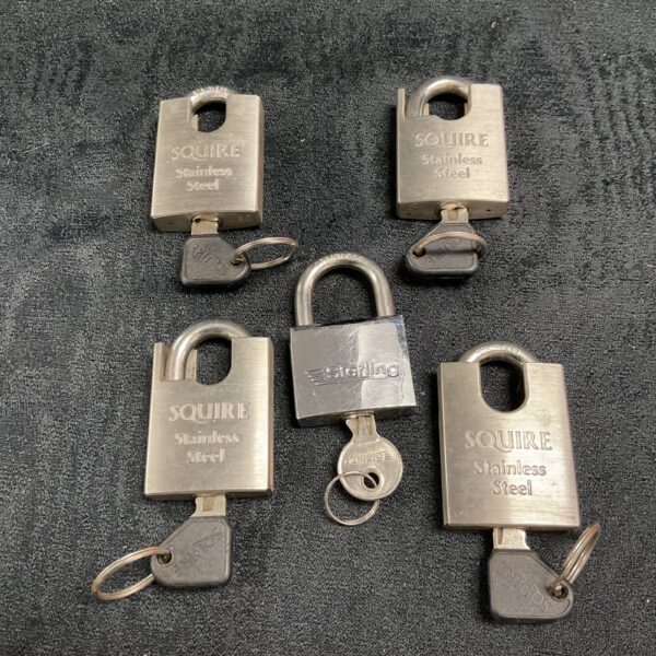 Lot of five Squire and Sterling stainless steel padlocks.