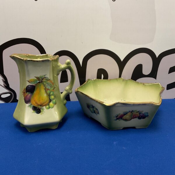 Antique Staffordshire ironstone jug and bowl with fruit pattern.