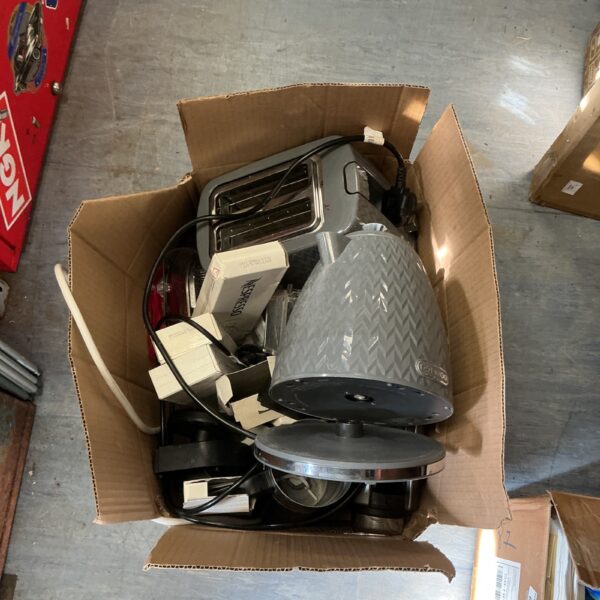 Stainless steel kettle and toaster set for kitchen use.