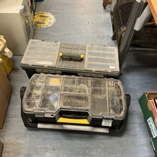 Pair of used Stanley tool boxes for workshop storage.