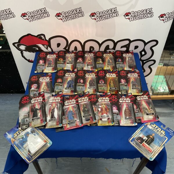 Lot of vintage Star Wars Episode 1 action figures in boxes.