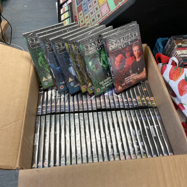 Sealed collection of Stargate SG1 DVDs for collectors.