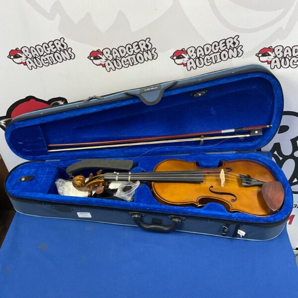 Stentor student 4/4 violin in open case with bow.