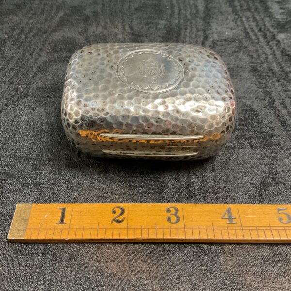 Antique sterling silver soap dish with hammered texture.