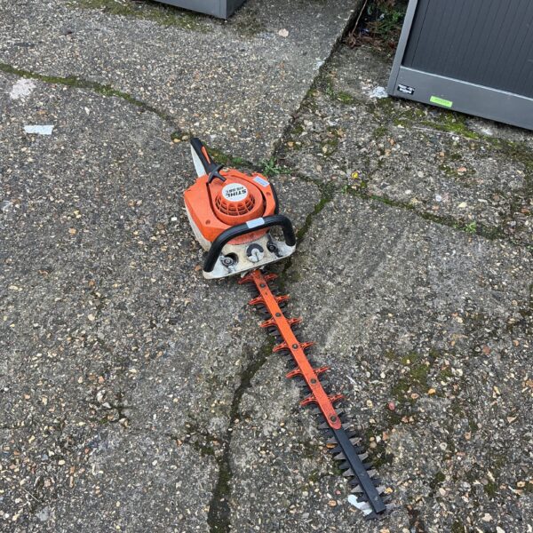 Used Stihl HS56 C petrol hedge cutter for garden trimming.