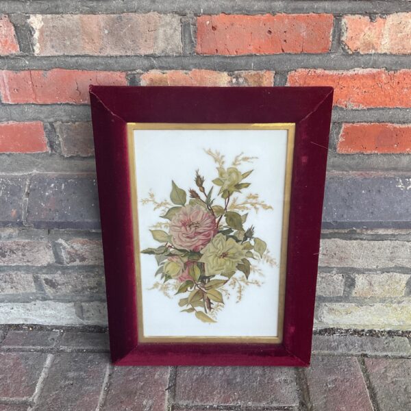 Vintage still life oil painting on opaque glass with red velvet frame.