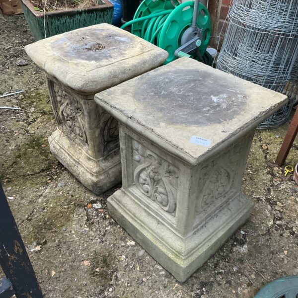 Two stone effect plinths for garden display and ornaments.
