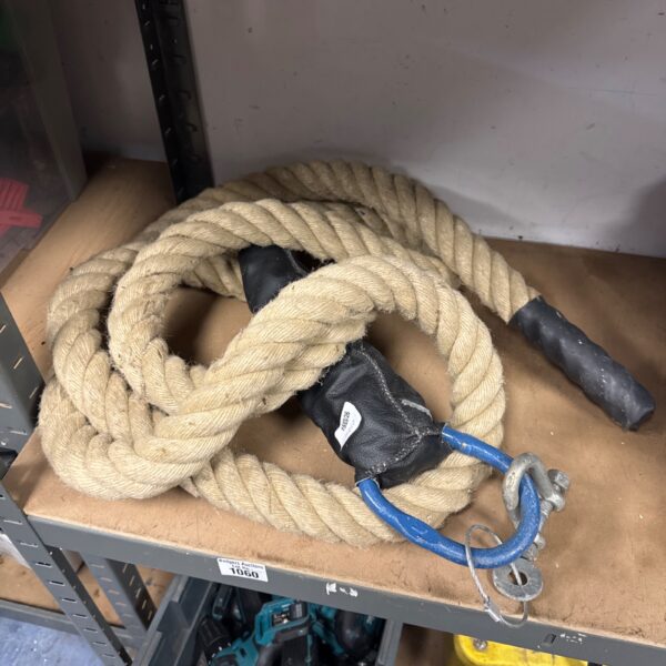Thick manila strongman rope with metal reinforcement.