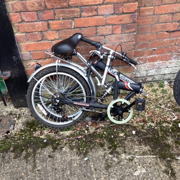 Compact Sunlova folding bike for urban commuting and portability.
