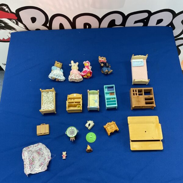 Sylvanian Families figures and furniture lot for dollhouse collectors.