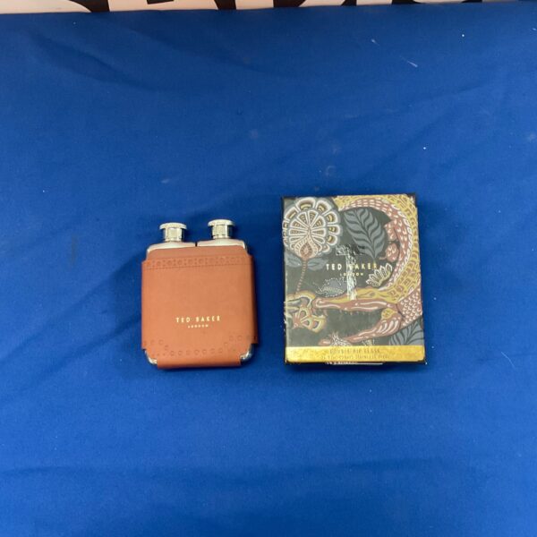 Ted Baker embossed hip flask in stainless steel.