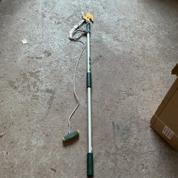 Telescopic branch loppers for reaching high branches in the garden.