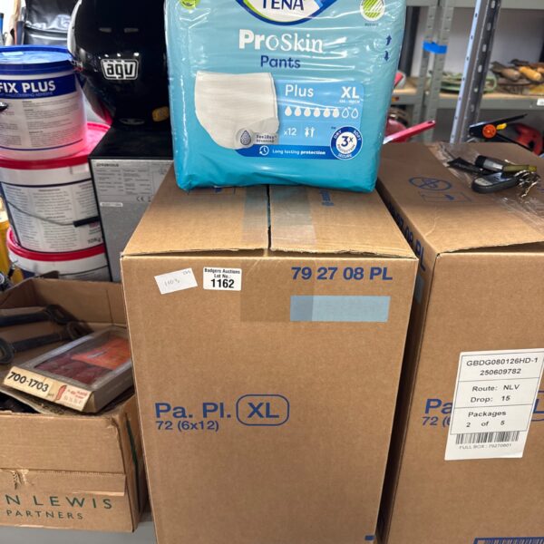 Sealed packs of Tena Proskin Pants XL incontinence wear.