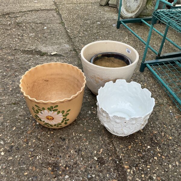 Vintage terracotta garden plant pot with floral design.