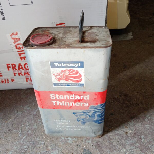 Vintage Tetrosyl Standard Thinners can with rust and wear.