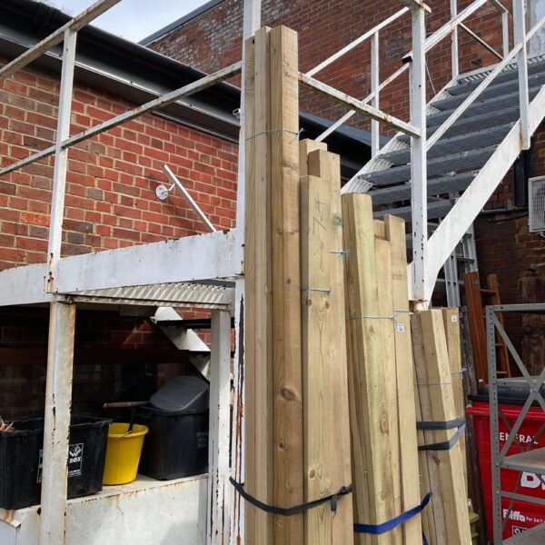 Stacked timber bundles for construction and DIY projects.
