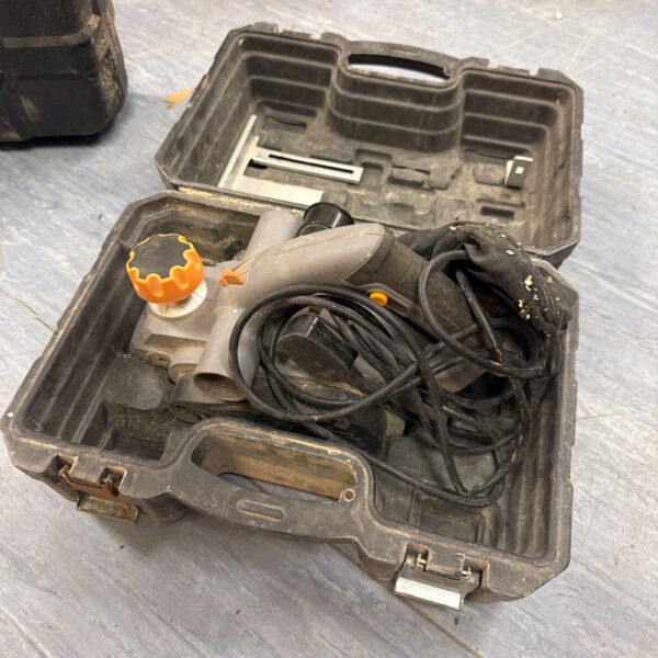 Vintage Titan electric wood planer in its original carrying case.