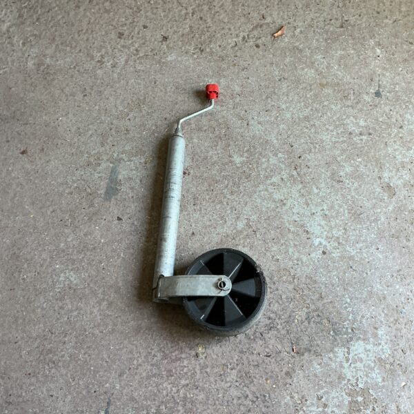 Side view of a used trailer guide wheel for sale.