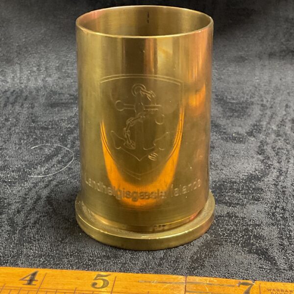 Antique brass trench art shell case with engraved crest.