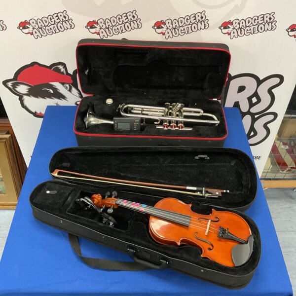 Musical instrument lot featuring a Tristar trumpet and Gear4music violin.