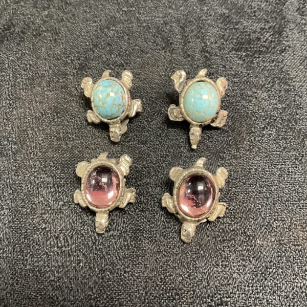 Vintage turquoise and amber turtle earrings with detailed stone inlay.