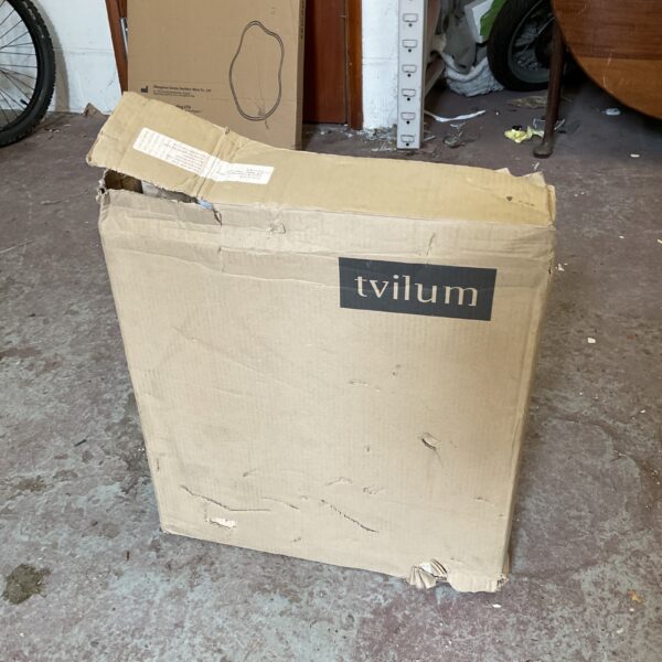 Unopened Tvilum cabinet packaging, model DM779, for home storage.