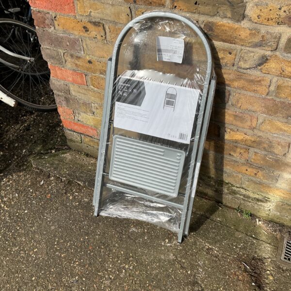 Aluminium two-step ladder for household use, showing signs of wear.