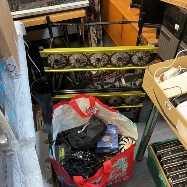 Front view of a Veddha crypto mining rig with multiple GPU slots.