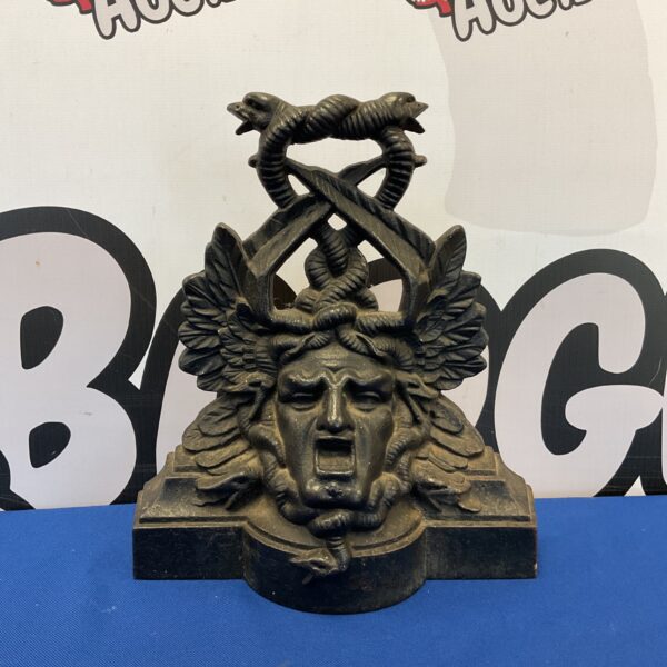Antique Victorian Falkirk doorstop with serpent design.