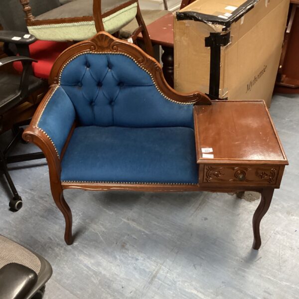 Victorian style mahogany side table with drawer and decorative details.