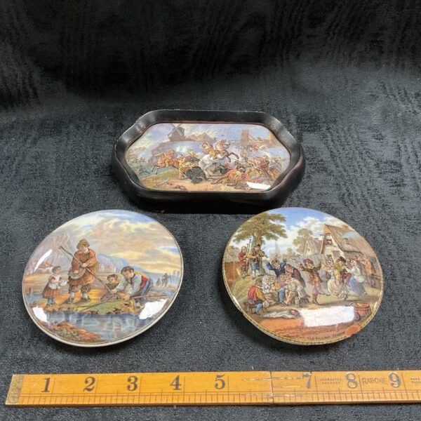 Antique Victorian Prattware pot lids with colourful pastoral scenes.